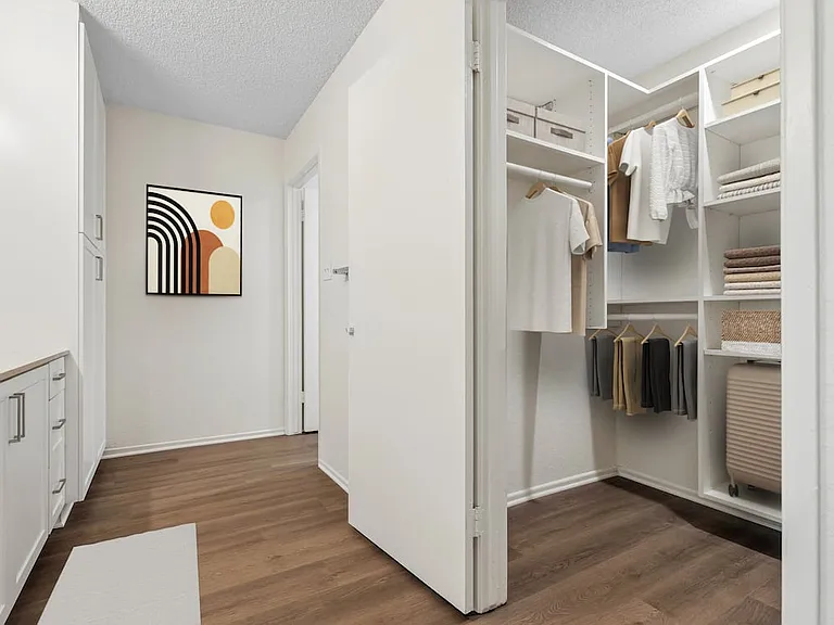 Renovated Package I bath with white cabinetry, beige quartz countertop, and hard surface flooring