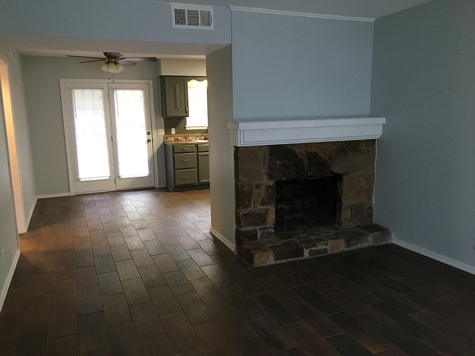  Large living room with wood burning fireplace. French doors