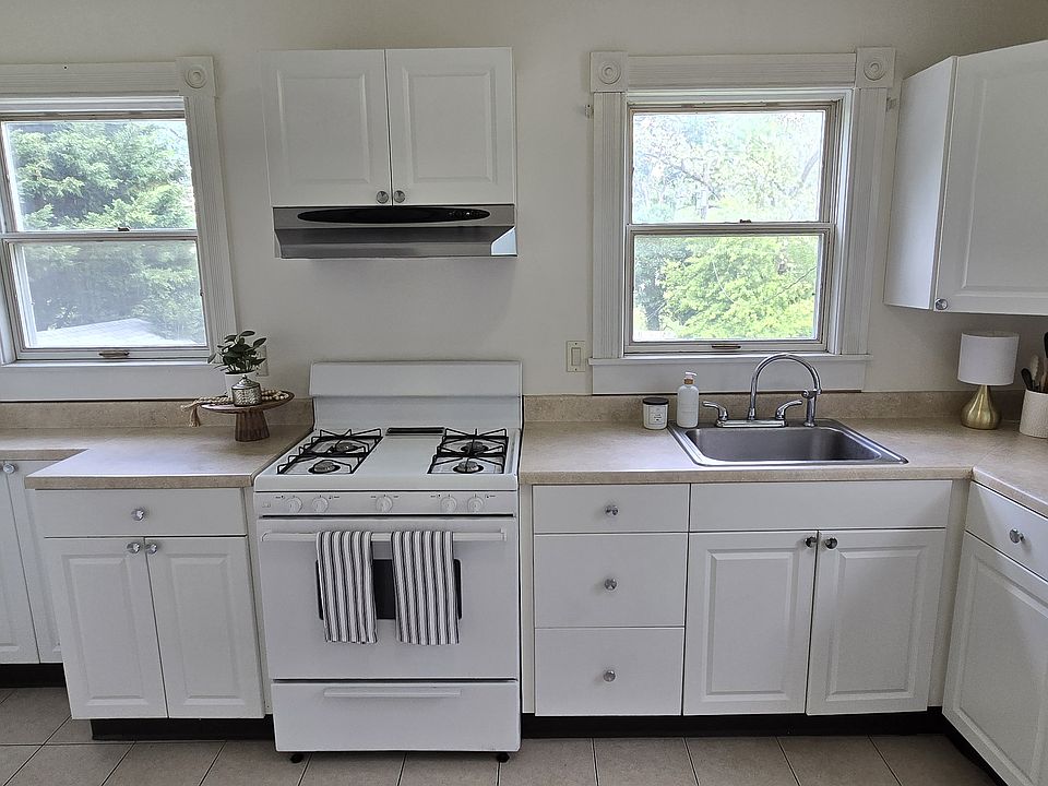 The kitchen is bright with plenty of cabinet storage and counter space. There is also a large pantry.