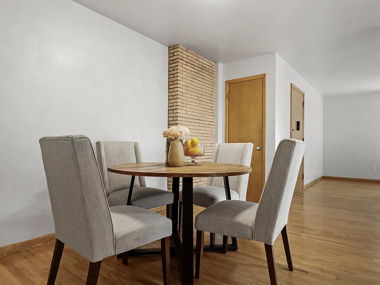 Spacious dining space and the washer and dryer provided for you, right behind that door!