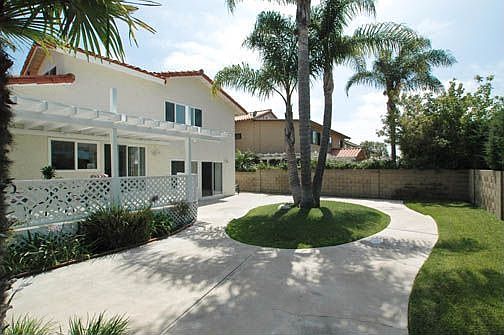 Gorgeious back yard with large deck.