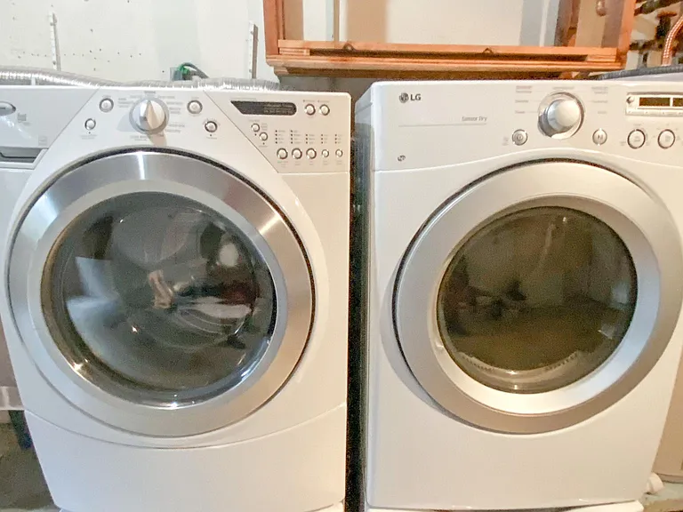 full size washer / dryer located in unfinished basement
