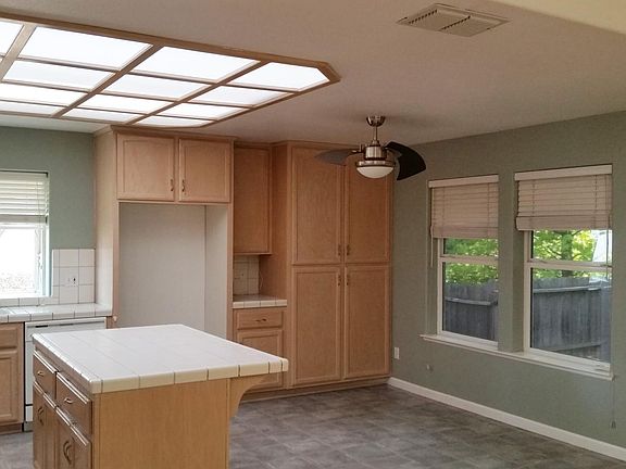 Large kitchen, open design with garden window and wonderful natural lighting and ventilation with windows and fan. Double oven and tons of cabinets here and in the large laundry room too! The laundry room has it's own basin.