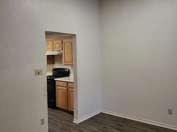 The dining area and entrance to the kitchen.