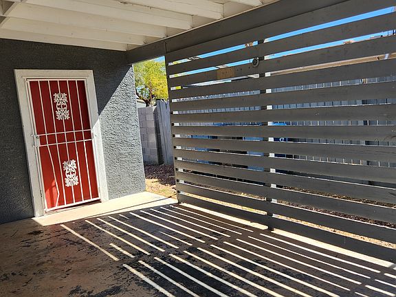 Carport with storage room