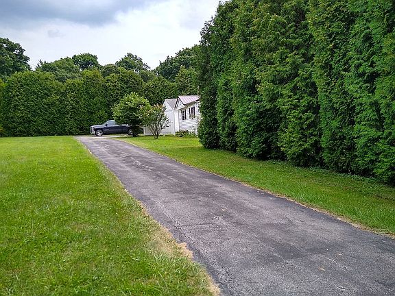 Blacktop driveway to house