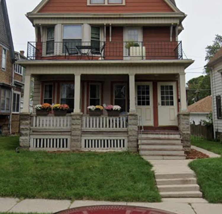 Front porch with three quarter fenced in back yard.