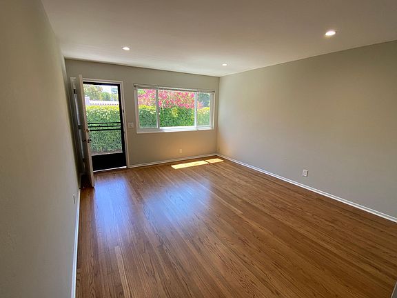 Living Room with refinished original hardwood floors, newly painted throughout the apartment