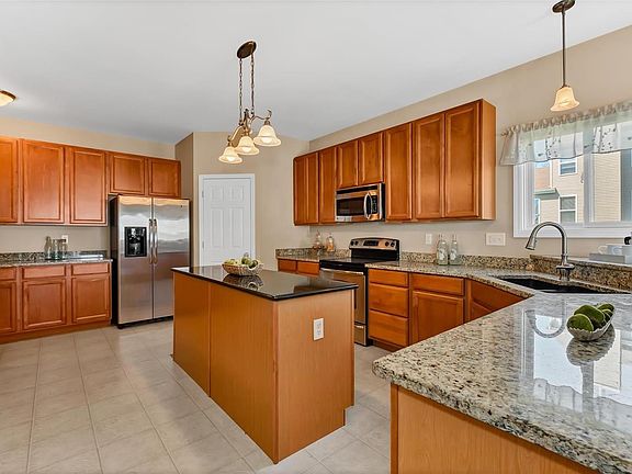 Dream kitchen with tons of 42" custom cabinetry, granite counters & huge pantry.