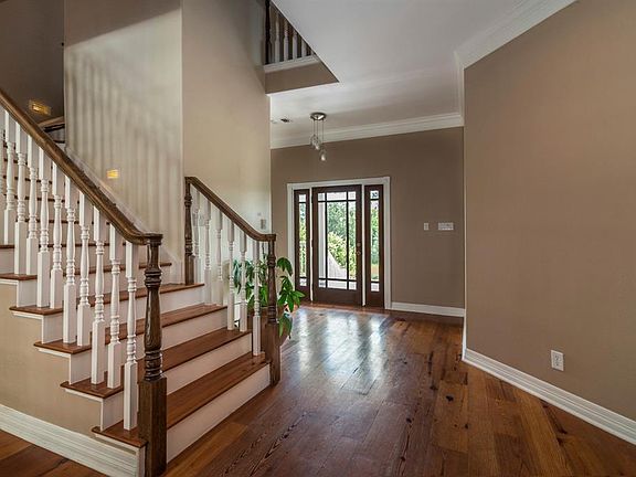 Reclaimed yellow pine flooring enhances the entry and main living areas.