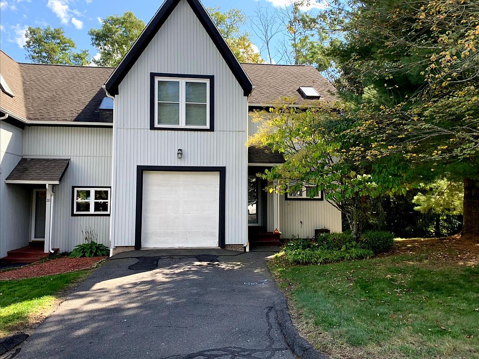 End-unit townhouse with attached garage with private driveway