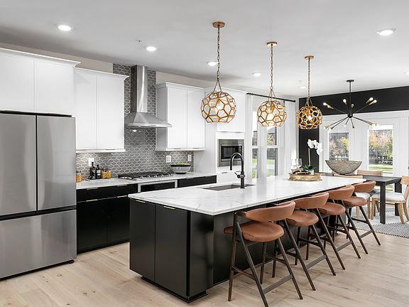 A sleek kitchen with high-end appliances and plenty of storage space.