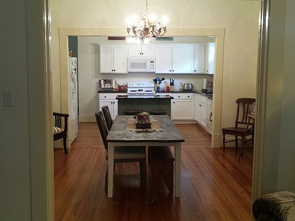 newly renovated kitchen with granite countertops, open to di