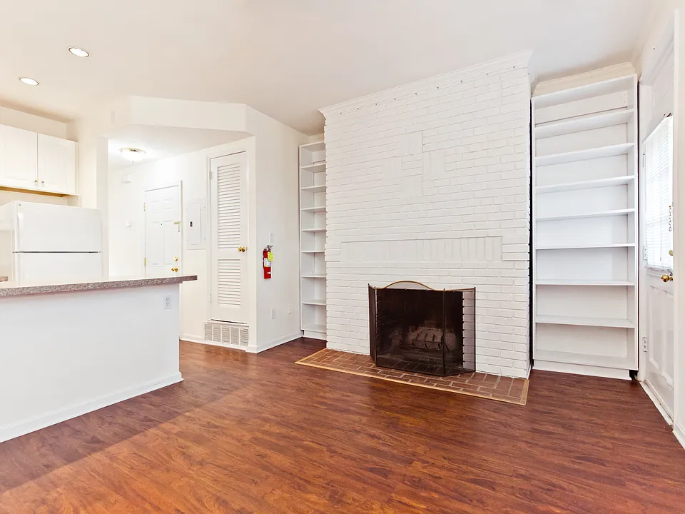 Living room with working fireplace and private rear exit door