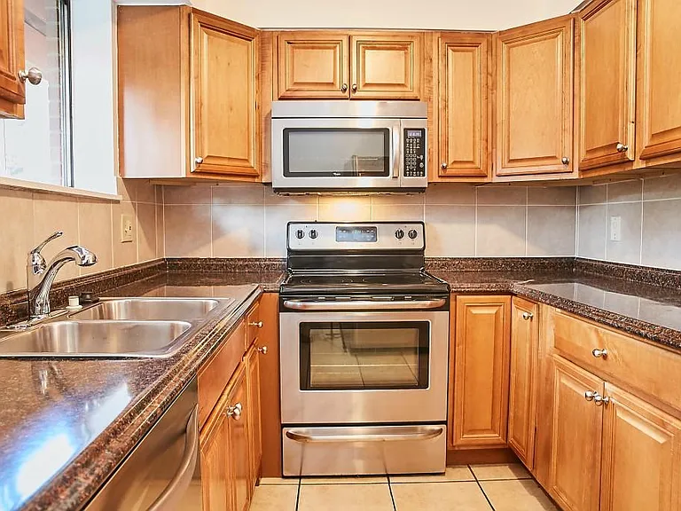 Kitchen with stainless steel appliances and beautiful wood cabinets