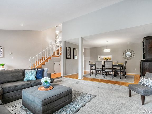 The living room flows through to the formal dining area, creating a large open area for entertaining. 