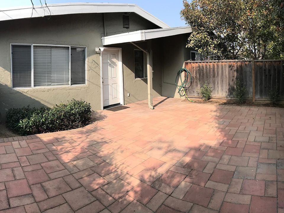 View of private, gated entrance and patio.