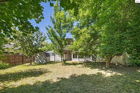 from the back fence looking at the house (completely fenced in)
