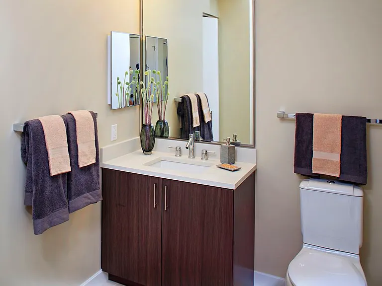 Classic Package I bathroom with espresso cabinetry, white quartz countertops, and hard surface flooring