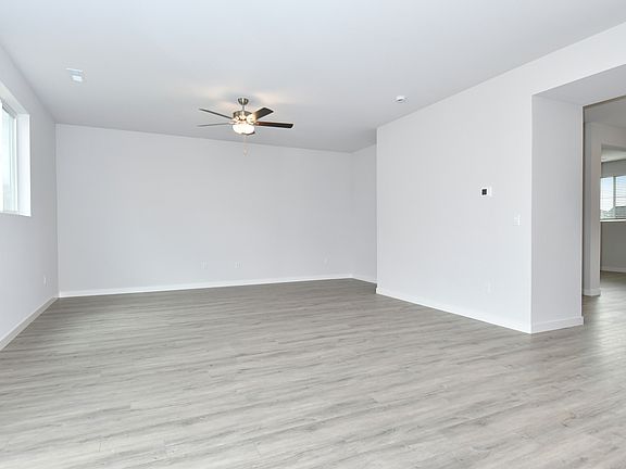 The living area is the perfect space for a family movie night or weekend football game.