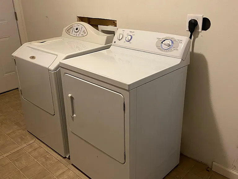 Washer and Dryer in separate utility room.