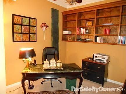 Office : Can be used as a dinning room. Custom built shelves. Crown Molding.Custom fan.