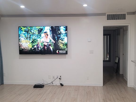 75" TV mounted in Living Room