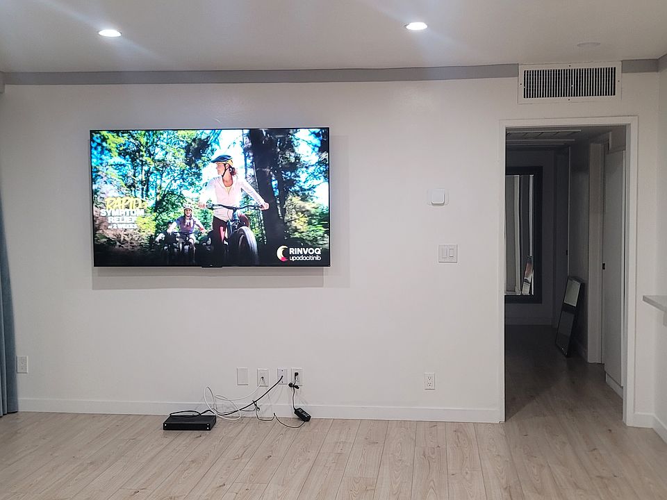 75" TV mounted in Living Room