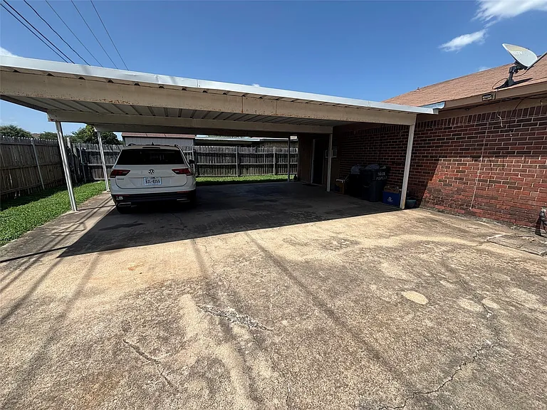 Covered carport providing sheltered parking