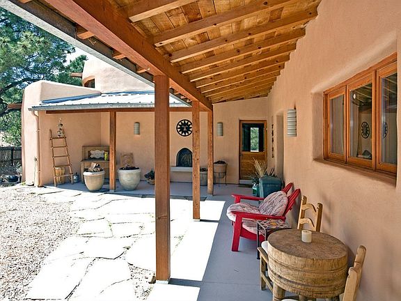 Charming adobe hm is a restful hideaway w/an authentic lodge like ambiance.