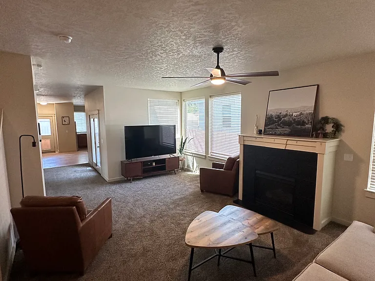 living room down stairs with 70'' TV