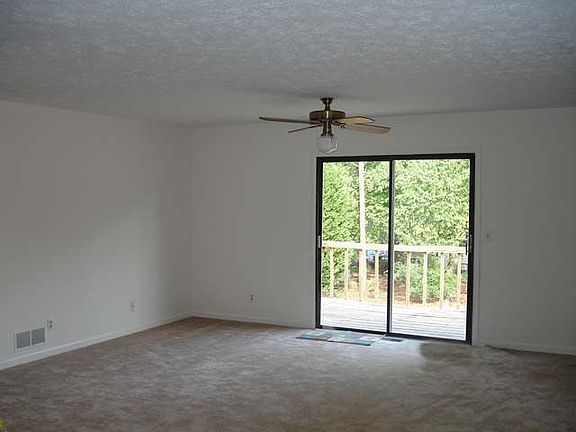 The living room overlooks the large back deck and back yard.