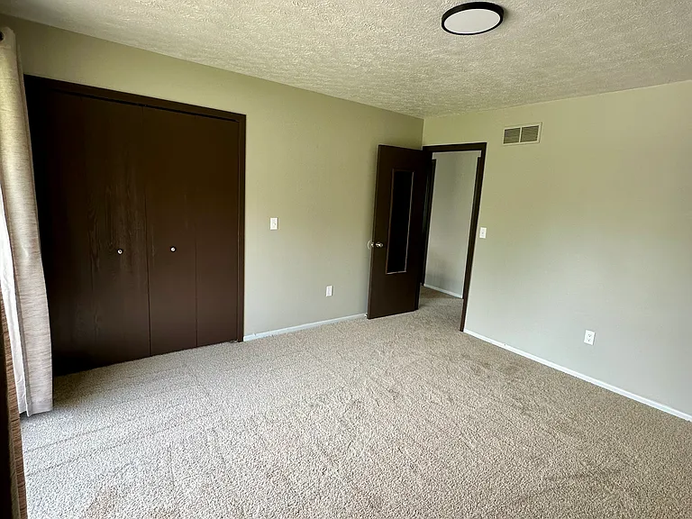 Second-Floor Primary Bedroom with Balcony