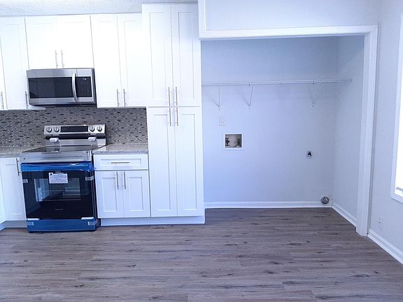 Full Size Laundry Closet in Kitchen for Convenience