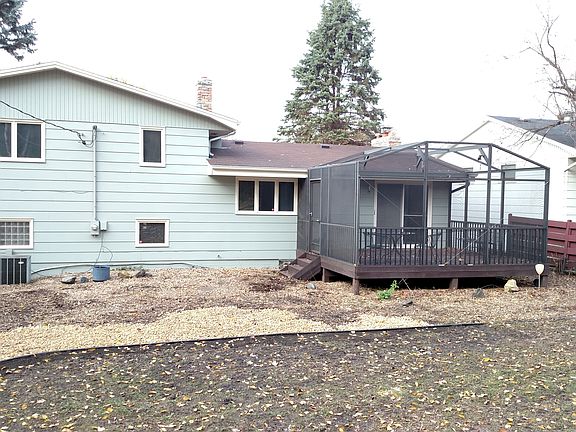 Check out the rear with the 3 season porch. Landscaping was