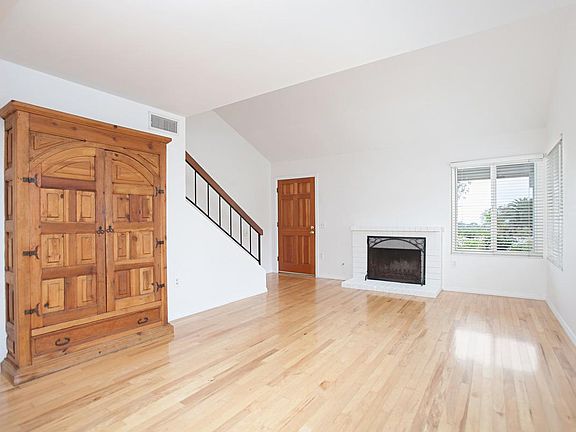 Built in entertainment center. Pecan real wood floors. Fireplace with gas starter.