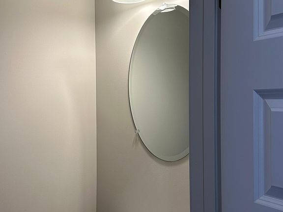 Convenient half bath located off the main hallway to the left as you enter the home_perfect for guests.