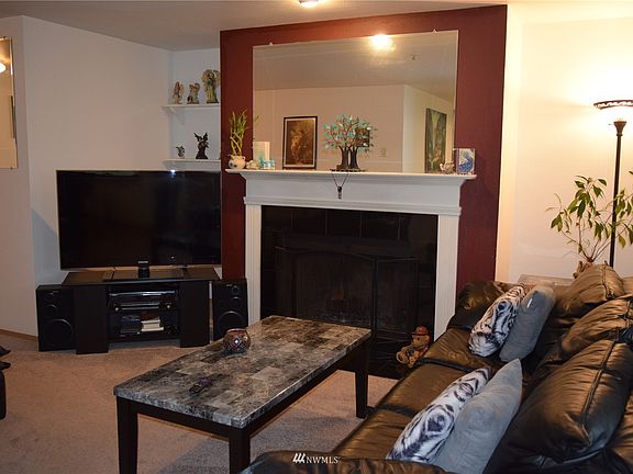 Living room with new carpet & updated fireplace