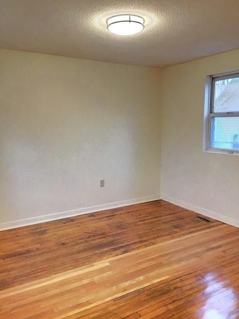 Freshly finished hardwood floors in bedrooms