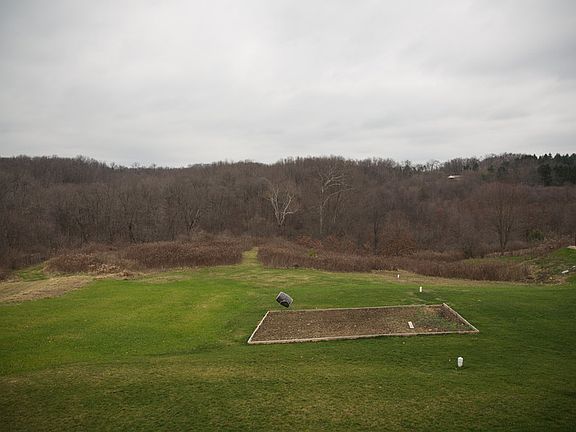 Backyard
						:
						View from deck. Garden has asparagus and berries but can be easily removed.