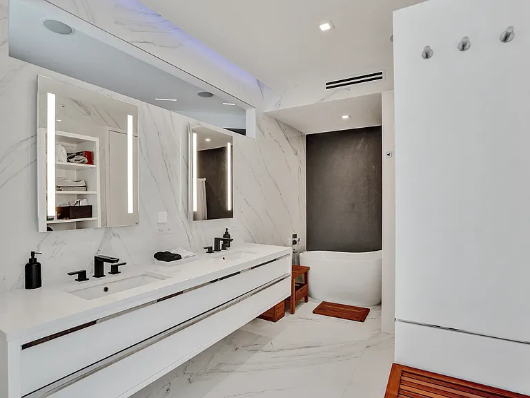 master bath with dual bathrooms