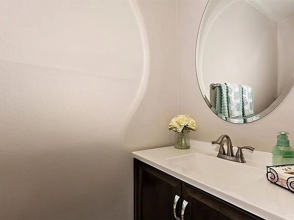 Guest half-bathroom located downstairs