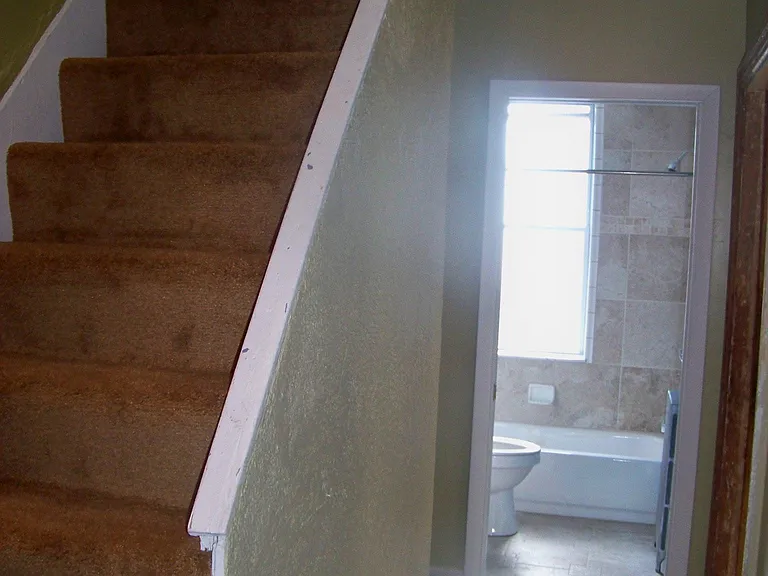 Stairs up to third floor
