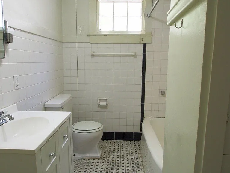 Tiled Bath with built in storage and storage closet (not shown.) Shared by 1sr and 2nd bedroom
