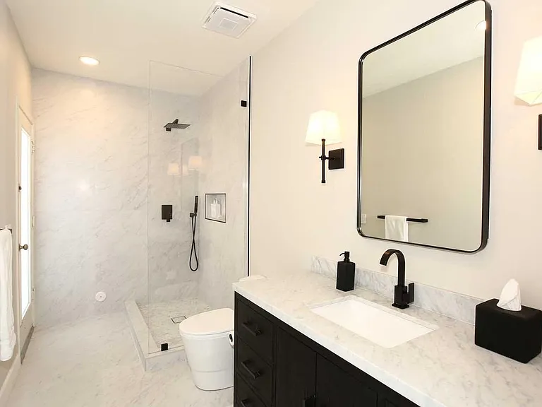 First Bedroom Bath with Exterior Door to Pool