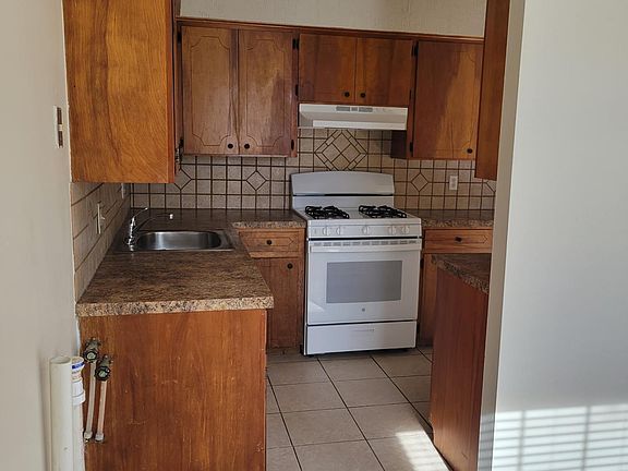 Kitchen comes with gas range & electric refrigerator. Washer/ Dryer (electric) hookup adjacent to kitchen.