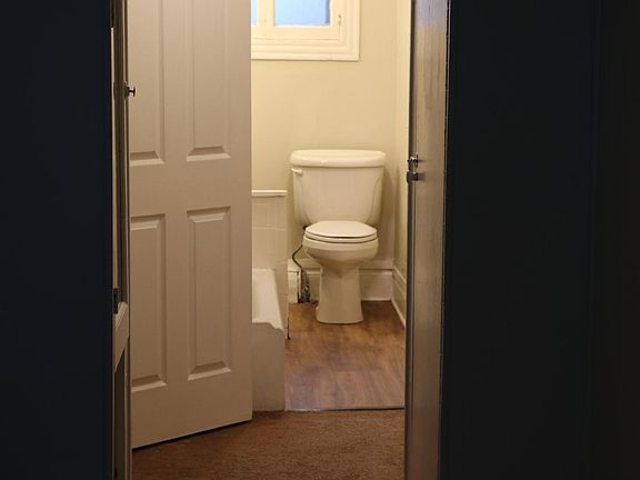 Interior hallway with door to bathroom