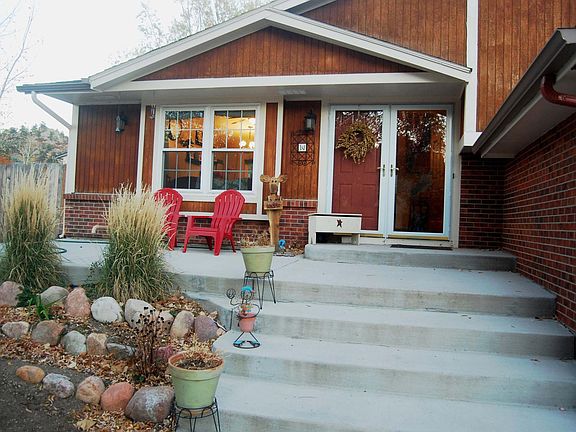 Beautiful front porch has mountain views and is shaded in su
