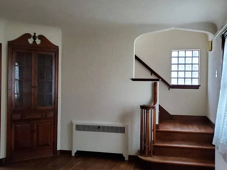 Living room 12X25 with built-in cabinents,stairway to second floor