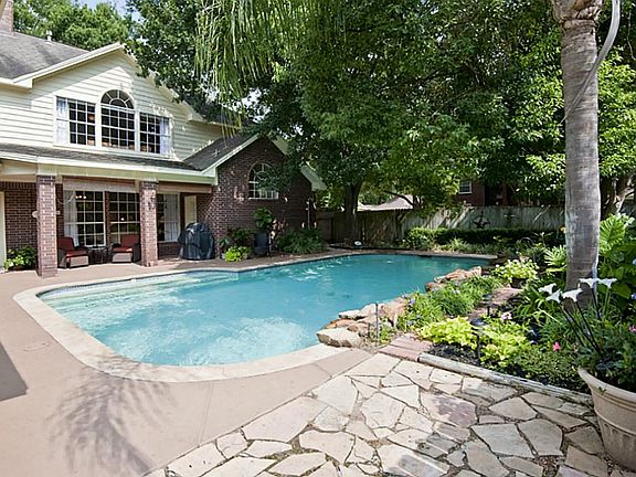 You'll be on Stay-cation all year in your private, backyard retreat. The pool boasts a rock waterfal